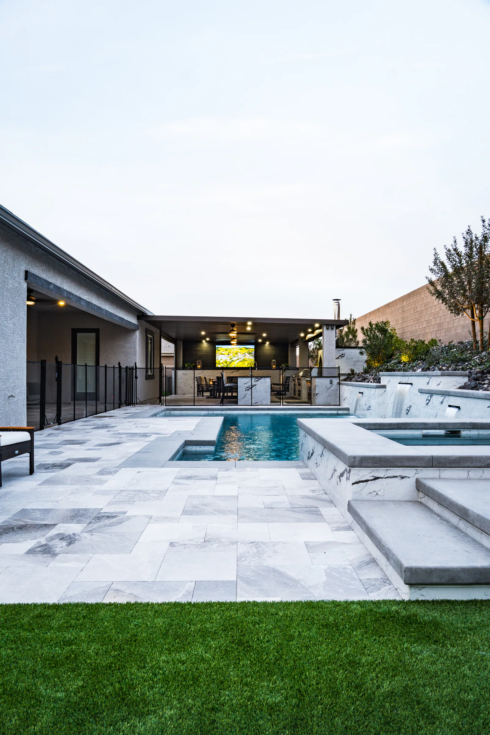 Guined project showing wide backyard pool spa pavilion turf