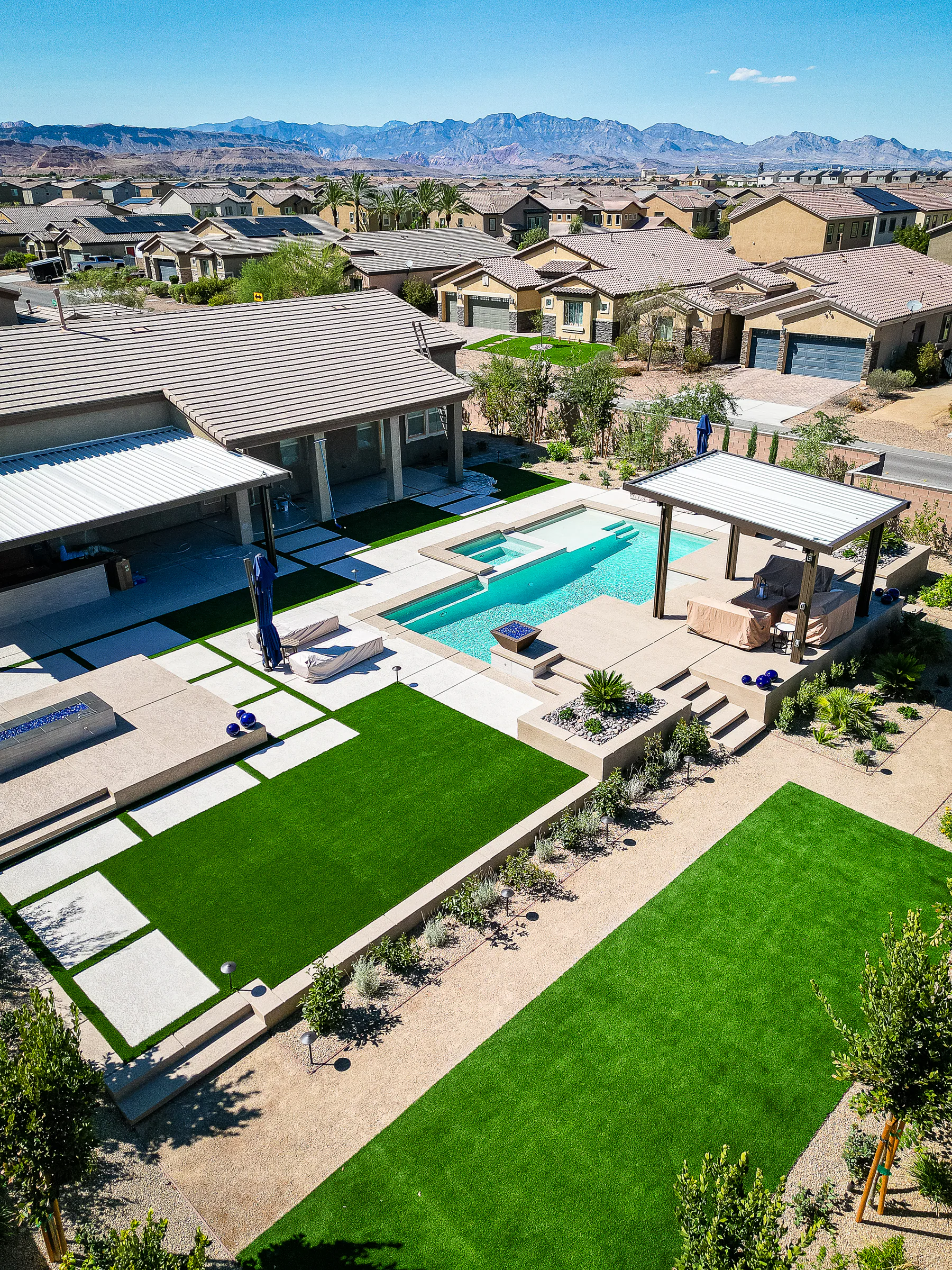 Hayes project showing high aerial pool pergola neighborhood mountains