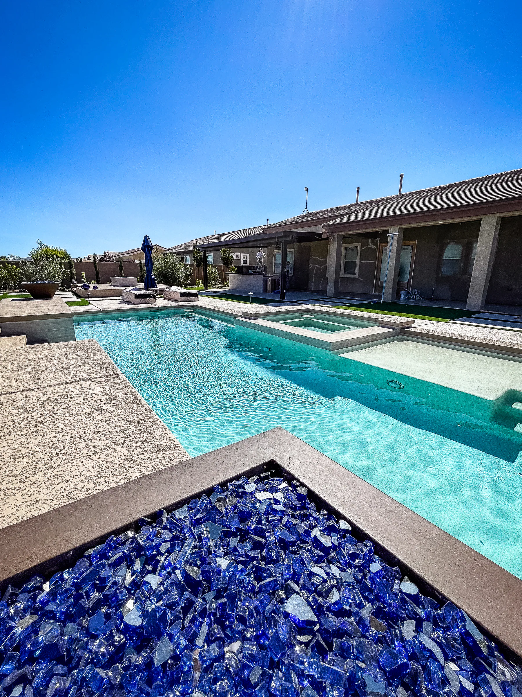 Hayes project showing pool spa fire pit glass close up