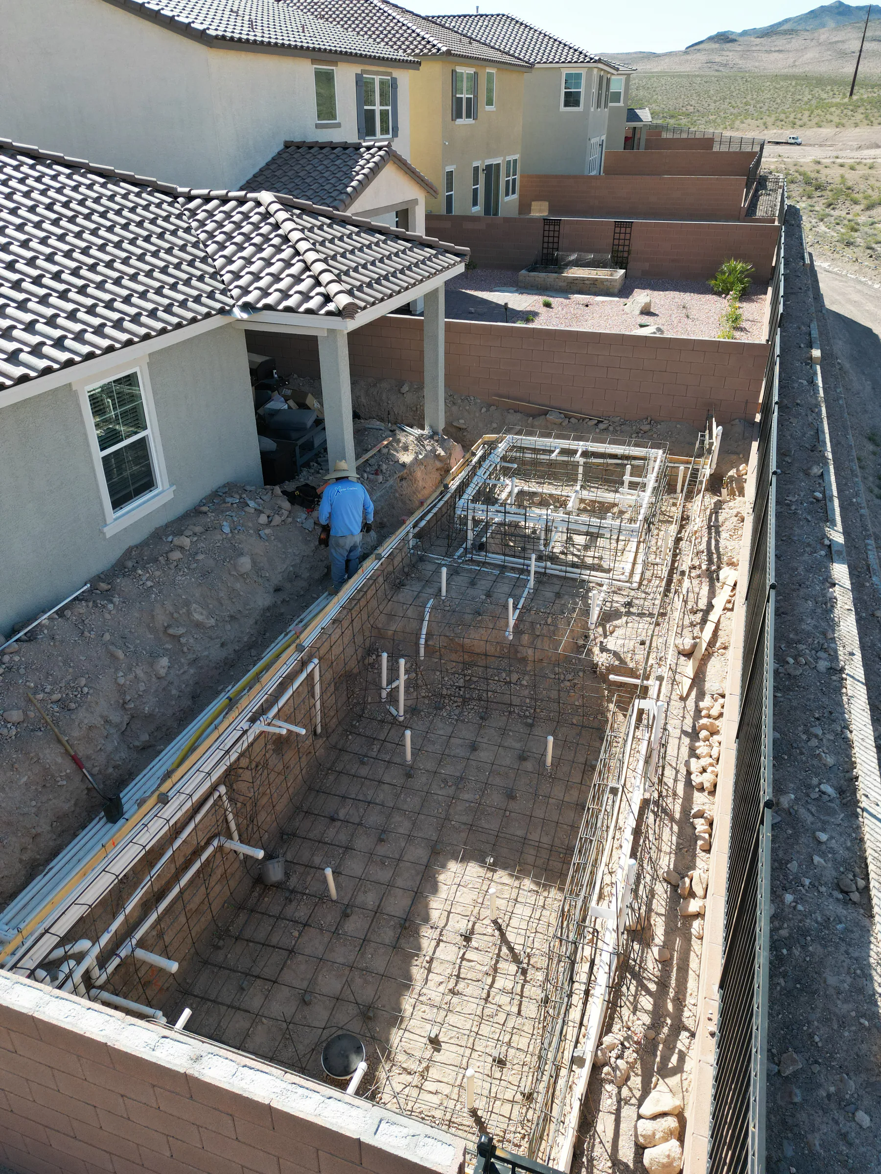 Pool plumbing lines installed within the reinforced steel structure