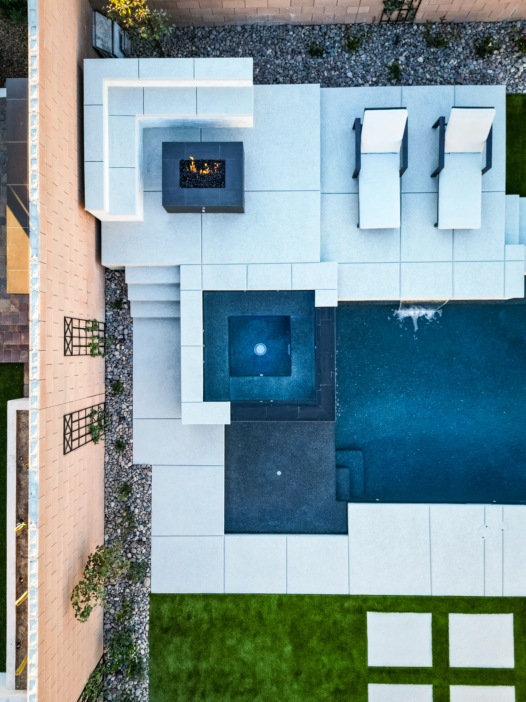 Palmer project showing drone topdown spa firepit flames bench