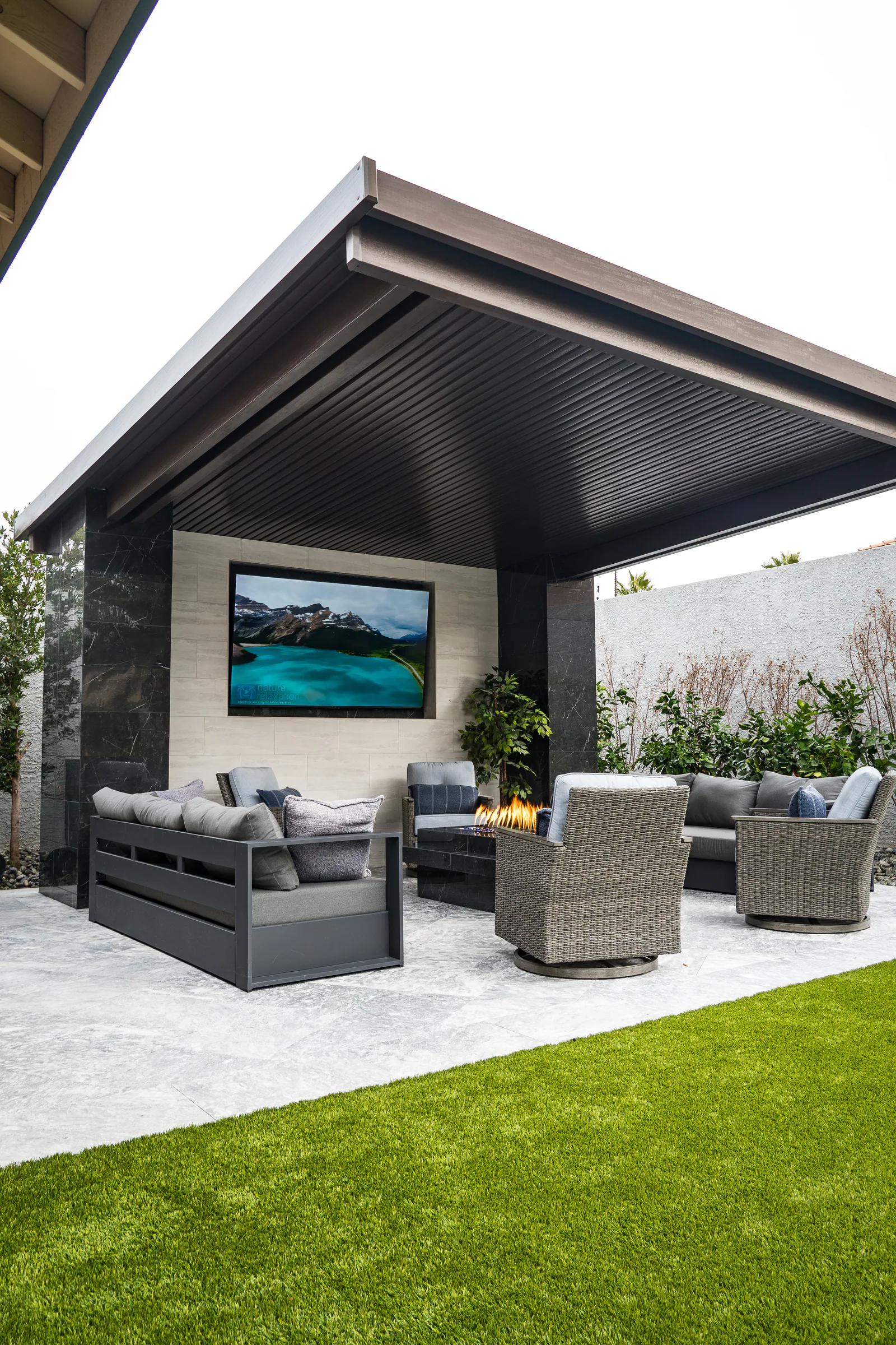 Medallion project showing rob desjardins cabana lounge tv fire pit sofas